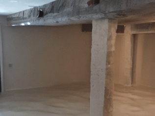 Crawl Space Encapsulation Services in Belleville, Encapsulation Services in Smith Falls, Crawlspace Encapsulation in Kanata, ON, Crawlspace Encapsulation in Barrhaven, Crawlspace Encapsulation near me, Contractor measuring foundation opening and drainage area for precise egress window installation